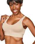 Woman wearing a beige sports bra against a white background